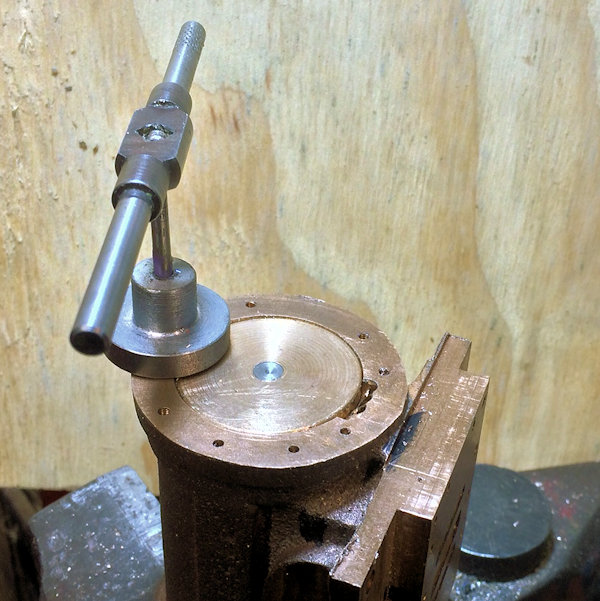 the tapping of an end cap hole